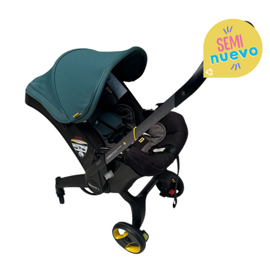 SEMINUEVO Carriola Doona Verde  con Base para el Carro